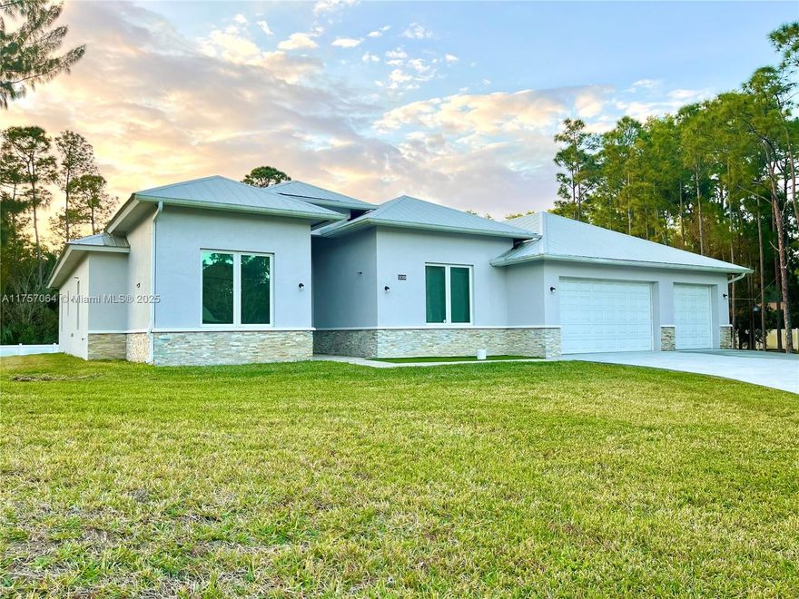 North of Indiantown in Jupiter Farms. Built in 2017, this spacious home features high ceilings and 4 oversized bedrooms. The master suite has 2 closets, a private master bathroom with a soaking tub, double sink vanities and an oversized shower. The open living space and kitchen are truly impressive with travertine marble flooring, large kitchen island and over 30 feet of cabinets and granite countertop space; a 8 x 5 pantry is next to the garage entrance. Enjoy the convenience of central vacuum, 3 cars garage, large driveway and a 15x 39 Lanai. Solid construction that includes concrete foundation, insulated pour concrete and rebar walls ICF, metal roof, PGT impact windows which exceeds any Hurricane building standards, and together with the solar panels contribute to low electrical bills