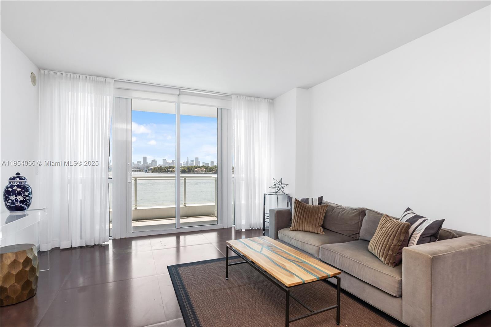 Located at one of Miami Beach’s most iconic waterfront addresses, The Bentley Bay, #312 is a beautifully appointed 1-bed, 1-bath offering the perfect blend of sleek design, natural light, and interior function. Floor-to-ceiling glass opens to a private balcony with expansive bay and skyline views — your front-row seat to golden hour. The open-concept layout flows effortlessly from the chef’s kitchen to the main living area, making it equally suited for quiet mornings or entertaining guests. The primary suite features generous closets and a spa-like bathroom. #312 offers five-star amenities. Situated on the West Avenue corridor, you're just five minutes to the beach, 15 minutes to Miami Airport, and walking distance to Whole Foods, Sunset Harbour, and the South of Fifth restaurant scene.