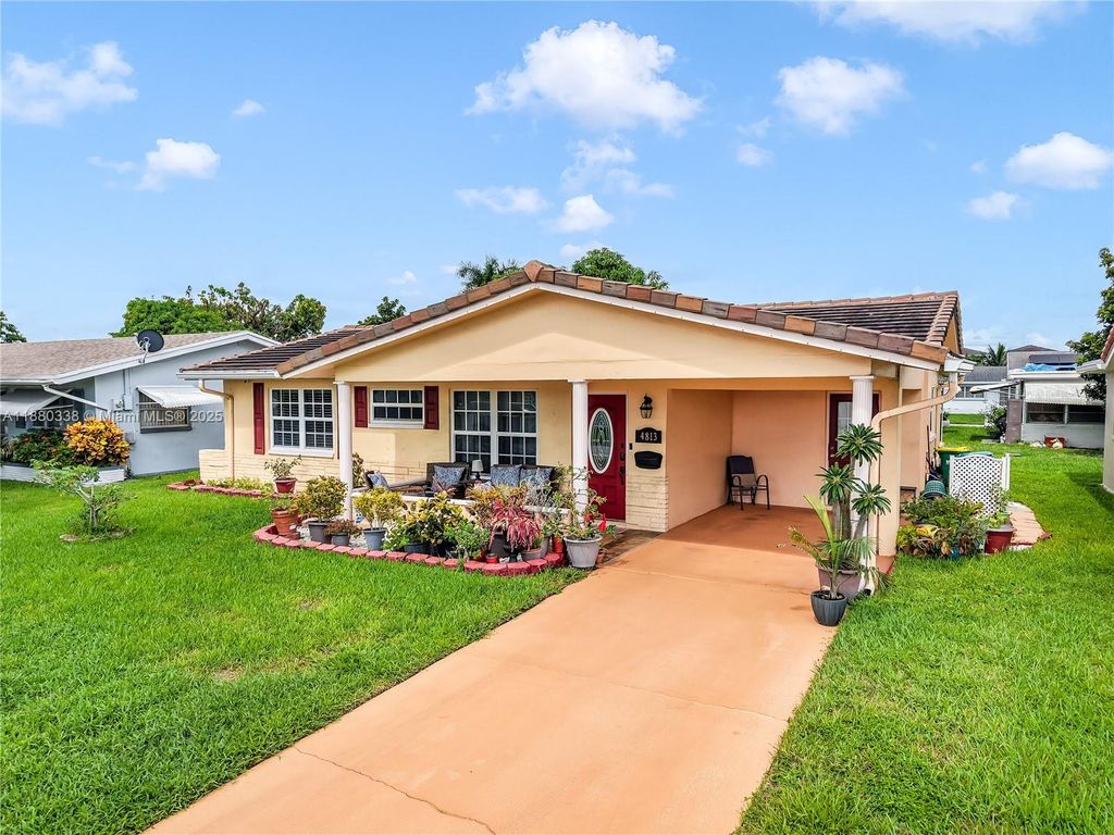 Photo of 4813 NW 47th Ter, Tamarac, FL 33319 (MLS # A11880338)