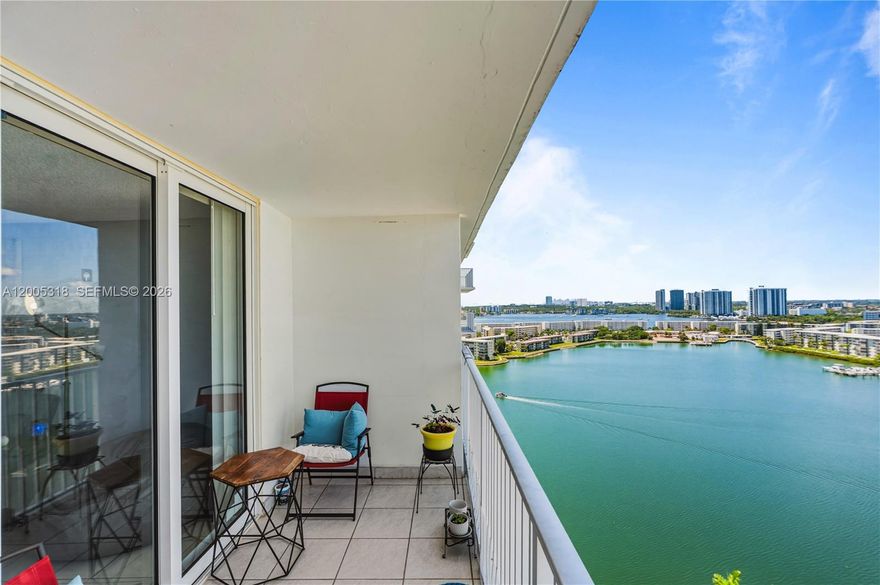 Great deal! Enjoy breathtaking Maule Lake, skyline, and pool views from this spacious 2-bedroom, 2-bath residence at Admirals Port in Aventura. Offering 1,220 SF plus a private balcony. This bright and airy unit features impact windows and doors installed in 2025. and a well-designed layout that flows seamlessly from the living area to a large terrace—perfect for dining, entertaining, or relaxing while taking in the views. The unit also offers the convenience of same-floor laundry, and one assigned uncovered parking space, along with ample guest parking and a storage bin located in the same floor. New HVAC system installed in 2023. Admirals Port is a full-service waterfront community with beautifully remodeled amenities, including 24-hour security, two heated pools, a BBQ area, tennis and basketball courts, a fitness center, a sauna, a library, a party room, a business center, billiards, and serene walking paths with a relaxation pond. Building updates include a new roof (2024), completed 40-year certification, and special assessment has been already paid by Seller in full. Prime location on prestigious Williams Island Blvd, within walking distance to restaurants, shops, and houses of worship, and just minutes from Aventura Mall, beaches, and major highways. Located in an A-rated school district.