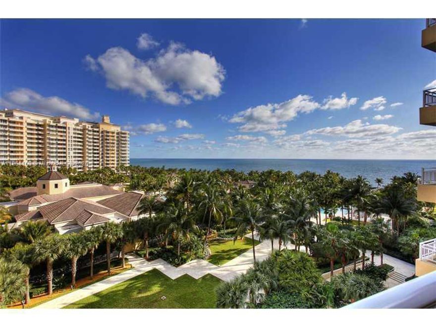 Experience the ultimate in oceanfront living! This spectacular flow-through 3 bed/3 bath condo offers sweeping ocean and bay views from every angle. Bright and spacious, it features professional design with Italian glass doors, European cabinetry, premium bath fixtures, and elegant marble floors throughout. Located in a world-class private members’ resort club, residents enjoy pools and beach service with attendants, a full-service spa, tennis, clubhouse, playground, and on-site restaurants. Luxury, comfort, and resort living—all in one.