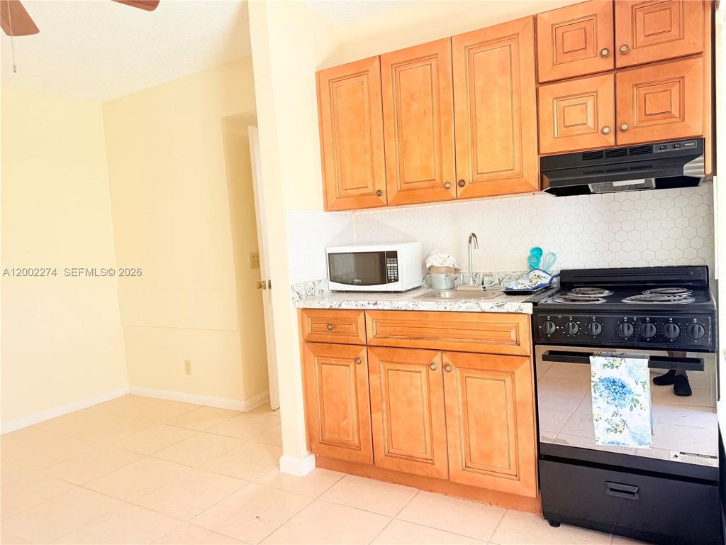 Photo of 10620 Sunset Strip #1, Sunrise, FL 33322 (MLS # A12002274)