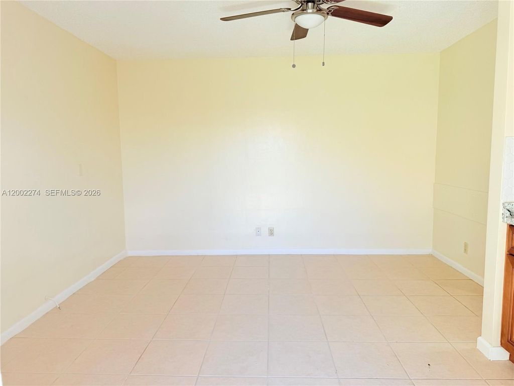 Photo of 10620 Sunset Strip #1, Sunrise, FL 33322 (MLS # A12002274)