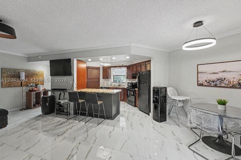 Photo of 6855 W Broward Blvd #201, Plantation, FL 33317 (MLS # A12043594)
