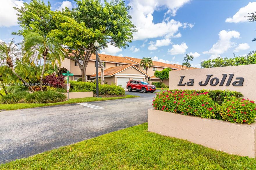 Desired La Jolla large corner townhome featuring 3 bedrooms, 2.5 baths, and abundant natural light. The kitchen offers French doors to the front patio and a pass-through overlooking the spacious open dining and family room. Tile flooring throughout the first floor and wood-laminate flooring on the second. The primary suite includes a generous en-suite bath and large walk-in closet with custom wood built-ins. Enjoy a fenced backyard with two private paver patios (front and rear)—perfect for entertaining and BBQs. Ample storage throughout, including spacious bedroom closets, under-stair storage, garage, and a separate laundry room. Centrally located in Kendall, walking distance to shops and restaurants. Community amenities include a pool and park.