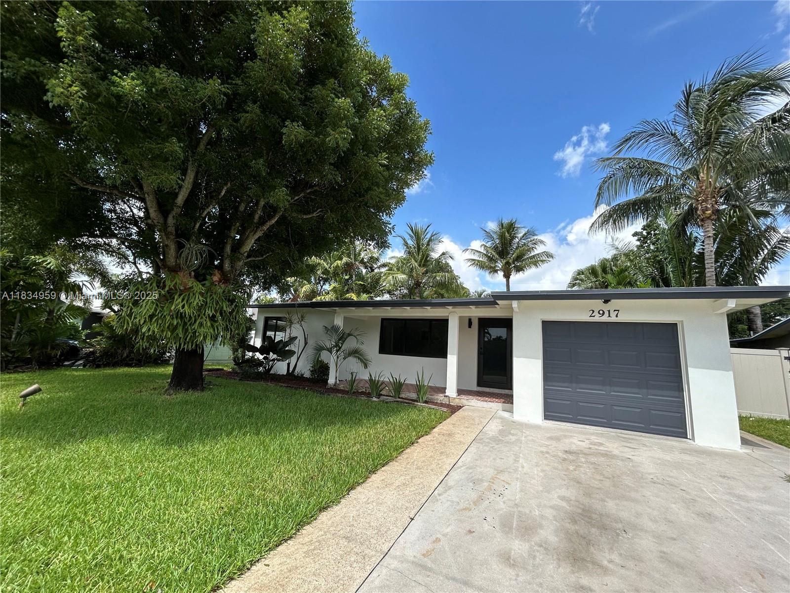 Beautiful Fully Remodeled Home in Wilton Manors. 2 Bedrooms and 1 Bathroom perfect for a couple or starter home. House has been done from top to bottom with New Hurricane Impact Windows and Doors, A New Roof, New A/C, New Tile Flooring Throughout, New Quartz Countertops, New Plumbing, New Electrical, and New Stainless Steel Appliances in the Kitchen. Backyard has a screened in porch and plenty of space for a pool to be built. Garage with new automatic door, could be converted to an additional room and bathroom. This home is a hidden gem on a quiet street in Wilton Manors and located just minutes from Popular Wilton Drive, Restaurants, Shopping, and Fort Lauderdale International Airport.