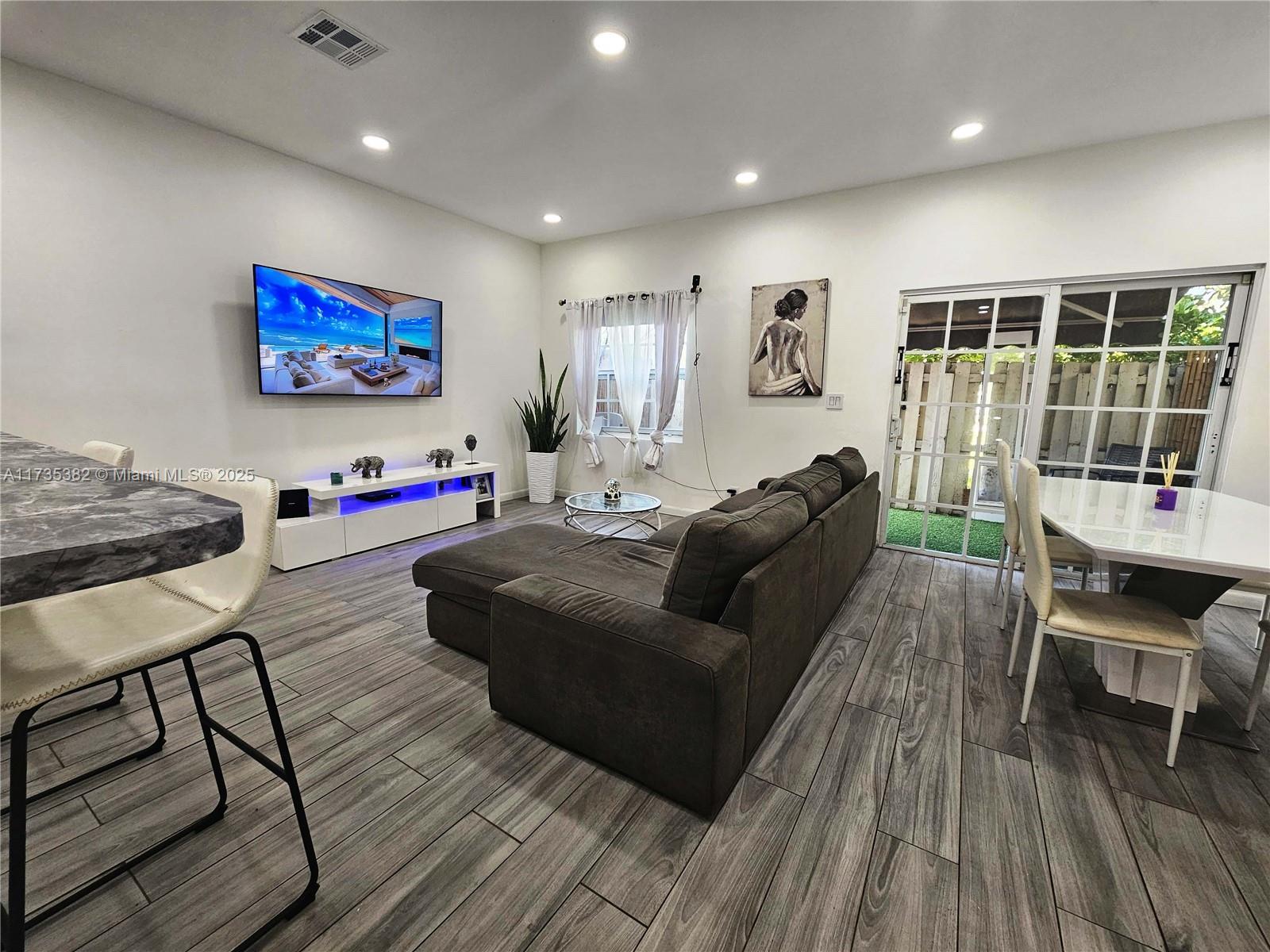 This well-maintained town home is centrally located in Hollywood, just minutes from Young Circle and the beaches. The home features ceramic flooring in the downstairs living area and wood flooring in the upstairs bedrooms. The spacious master bedroom includes a walk-in closet, while the second and third bedrooms share a convenient Jack & Jill bathroom.
Cozy private outdoor patio
Upgraded bathrooms, with a Jacuzzi-style bathtub in the master bath
Laundry room with washer and dryer
Two designated parking spaces
Electric water heater upgrade
240V electric car charger installed
The garage offers a built-in infrared sauna and gym on one side, with ample storage space on the other. No appraisal contingency.