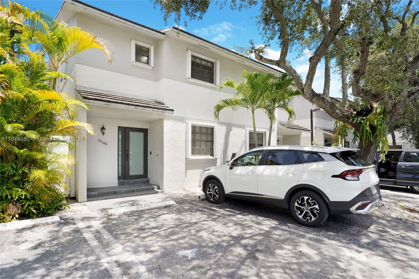 Beautifully renovated 3-bedroom, 3-bathroom townhouse located in a small quiet community of just 8 townhomes tucked away in Alhambra Gate steps away from Coral Gables. This residence offers 2 assigned parking spaces conveniently located right outside the front door. The first floor features an oversized kitchen & living area filled with natural light, & a bedroom & full bathroom. Upstairs, 2 bedrooms with en-suite Bathrooms & spacious Walk-in Closets. Nice private balcony in master bedroom. Step outside to enjoy your own private patio. Impact Doors & Washer/Dryer. Water is included! Just a short walk to Coral Gables' vibrant Miracle Mile. With Coconut Grove, Brickell, and Downtown Miami all easily accessible, this location truly offers the best of Miami living.