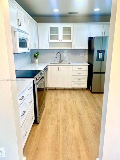 Photo of 1057 NW 83rd Ave #D47, Plantation, FL 33322 (MLS # A11891722)