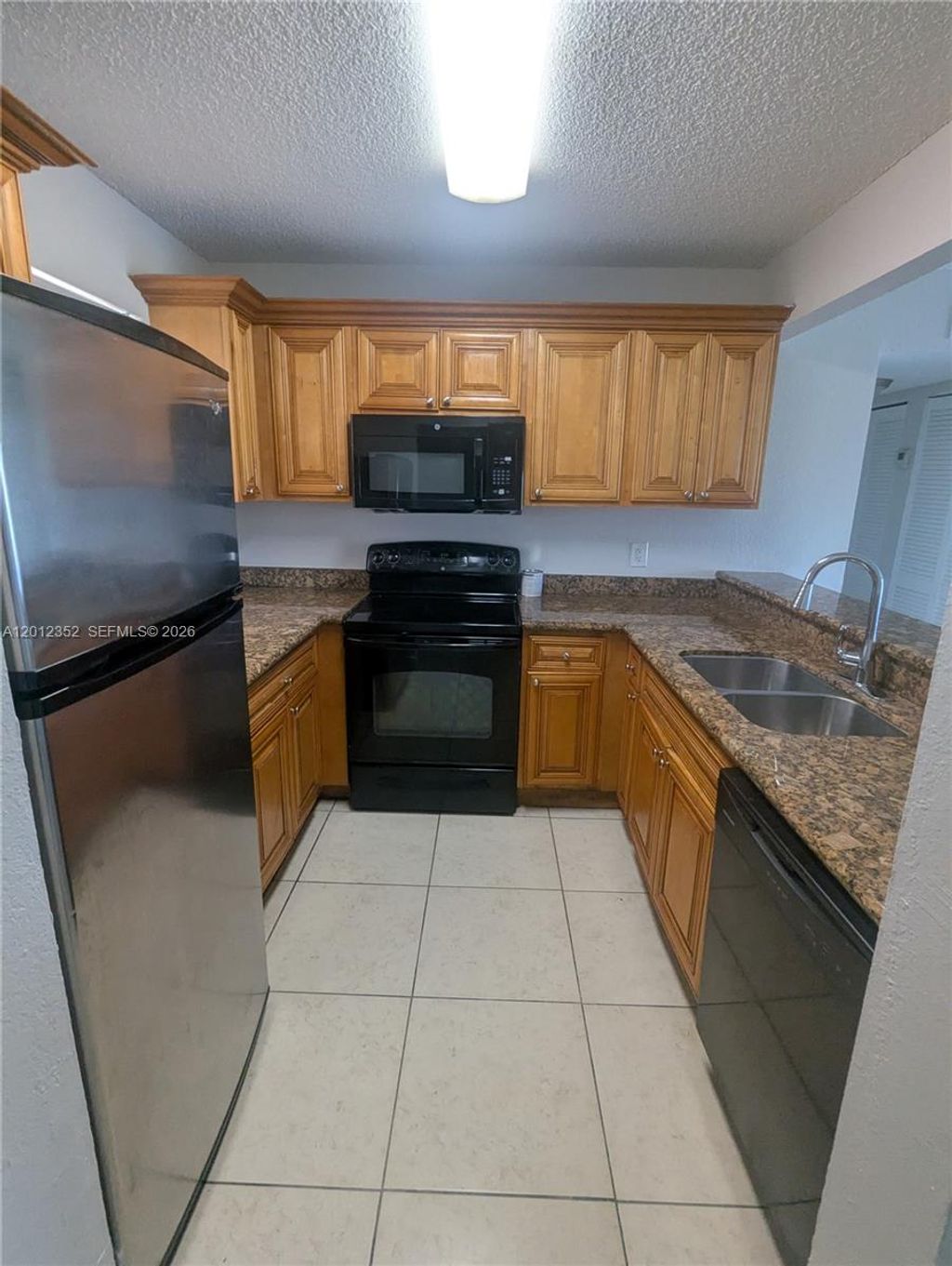 Photo of 1564 Lake Crystal Dr #F, West Palm Beach, FL 33411 (MLS # A12012352)