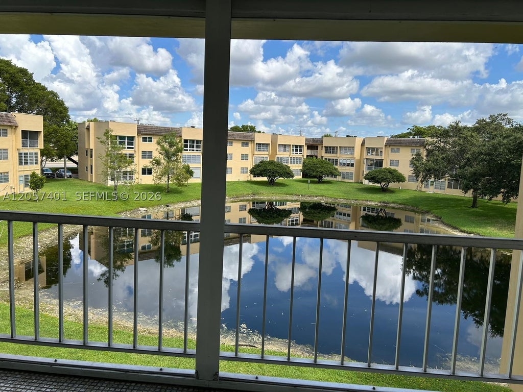 Photo of 6090 NW 64th Ave #311, Tamarac, FL 33319 (MLS # A12057401)