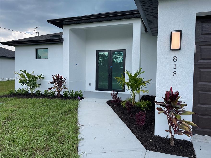 Welcome to your dream home in Lehigh Acres! This stunning single-family home boasts 3 bedrooms, 2 bathrooms, and a spacious 2-car garage. The modern finishes include granite counters, stainless steel appliances, and high impact windows. With high ceilings and a canal waterfront view, this home offers a luxurious and peaceful retreat. The best part? No HOA fees or CDD taxes to worry about. Don't miss out on the opportunity to own this beautiful property in a desirable location. Make this house your home today!