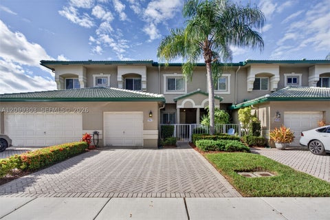 Photo of 7917 Exeter Blvd E #101, Tamarac, FL 33321 (MLS # A12099303)