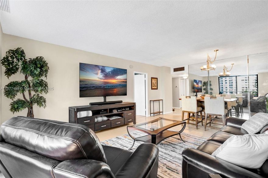 Stunning views of the marina and lush greenery from this beautifully kept home. Coastal chic design highlighted by neutral, wood style floors. The eat-in kitchen showcases quartz counters, updated lighting, and stainless steel appliances. The primary suite offers a large walk-in closet and brand new carpet. Step onto your private balcony with a serene view of Olympus’ resort inspired grounds. The community features two pools, five newly updated tennis courts, BBQ area, car wash station, and more. The renovated clubhouse boasts a modern fitness center, saunas, yoga room, café, and separate locker rooms for men and women. Ideally located just minutes from the beach, Aventura, dining, and shopping.