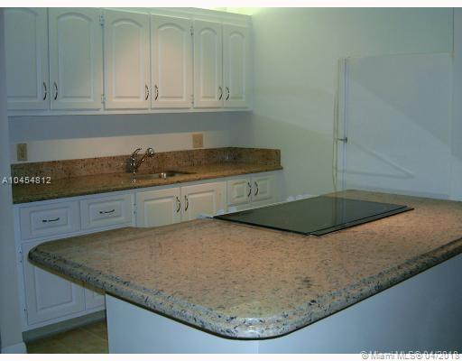 Beautiful updated one bedroom 1 1/2 bathroom unit in Century Village. Open Granite kitchen, Glass flat range, Tile floors, updated ceramic Bathrooms. Third Floor. Building with elevator. Great and very secure guard gated complex. Resort style amenities.