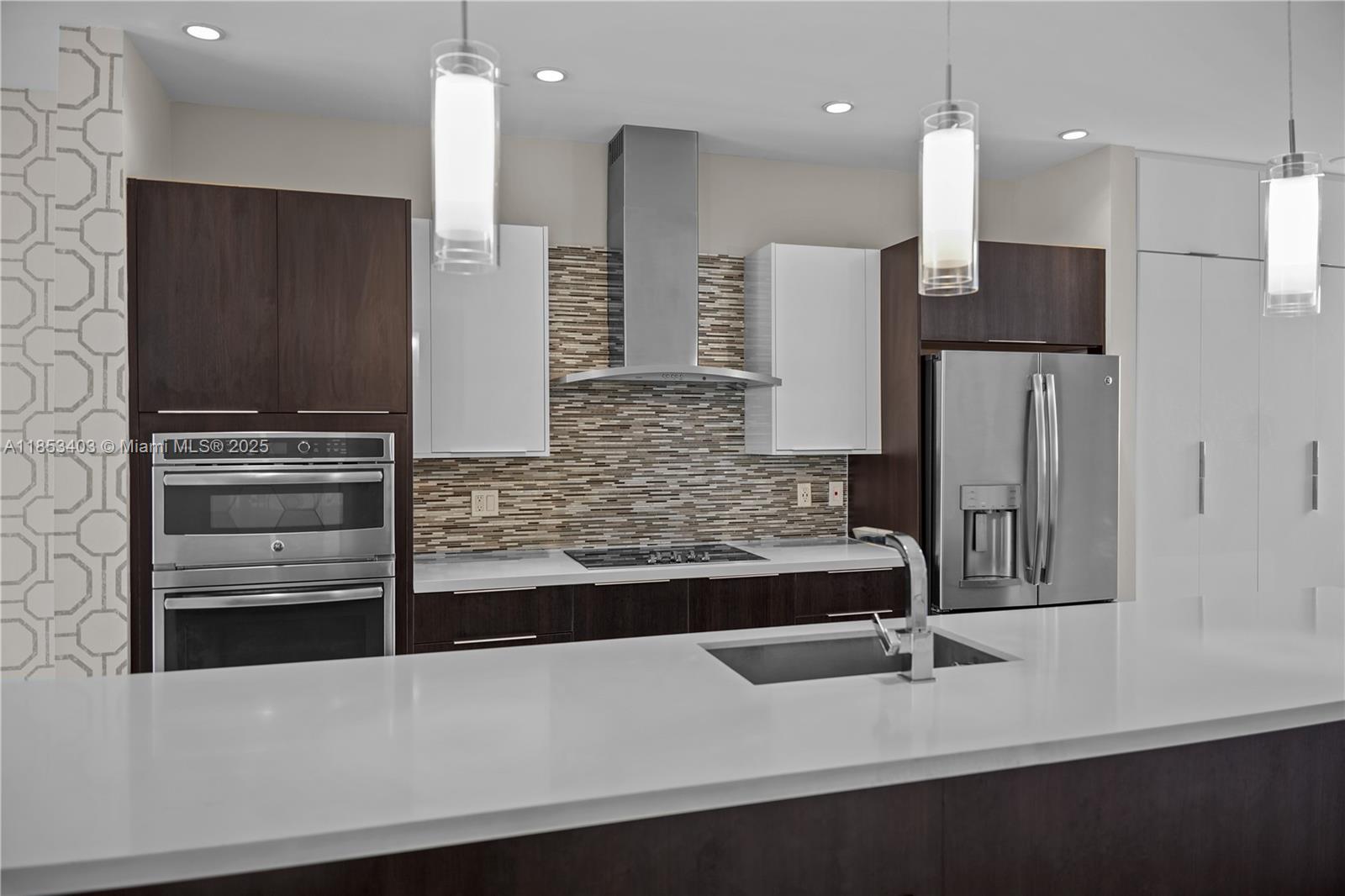 Beautiful Tri level Townhome garage on first level, common areas on second and bedrooms on third. Unit features elegant custom wallpaper and one of a kind custom carpentry, open concept layout , high ceilings and abundant natural lighting., MOVE IN READY HOME. Only first Month and security deposit required.