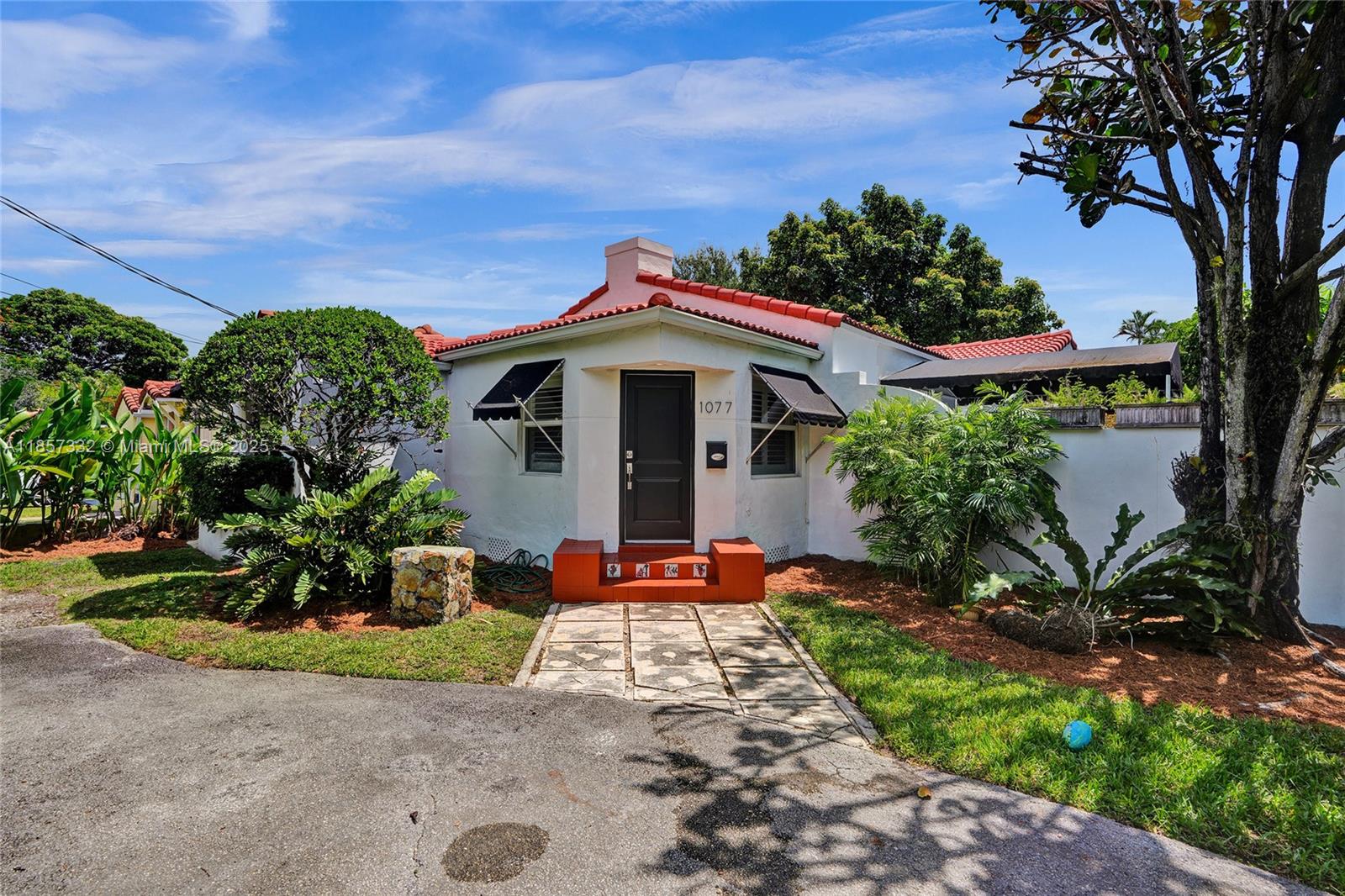 Beautifully kept Old Spanish home on a corner lot in Little Gables, FOR LEASE. Featuring: Freshly painted,
wood floors and travertine marble throughout, spacious living areas, updated wood/granite kitchen, California closets, and impact windows/doors. Includes: indoor front-loading washer/dryer, circular driveway, lush gardens, wooden porch with awning, and detached storage shed. Unique architectural details throughout. Lawn care and bulk waste included in rent. Prime location with easy access to Downtown Coral Gables, shops, and just 15 mins to the airport. Charming and move-in ready! This home will not last!