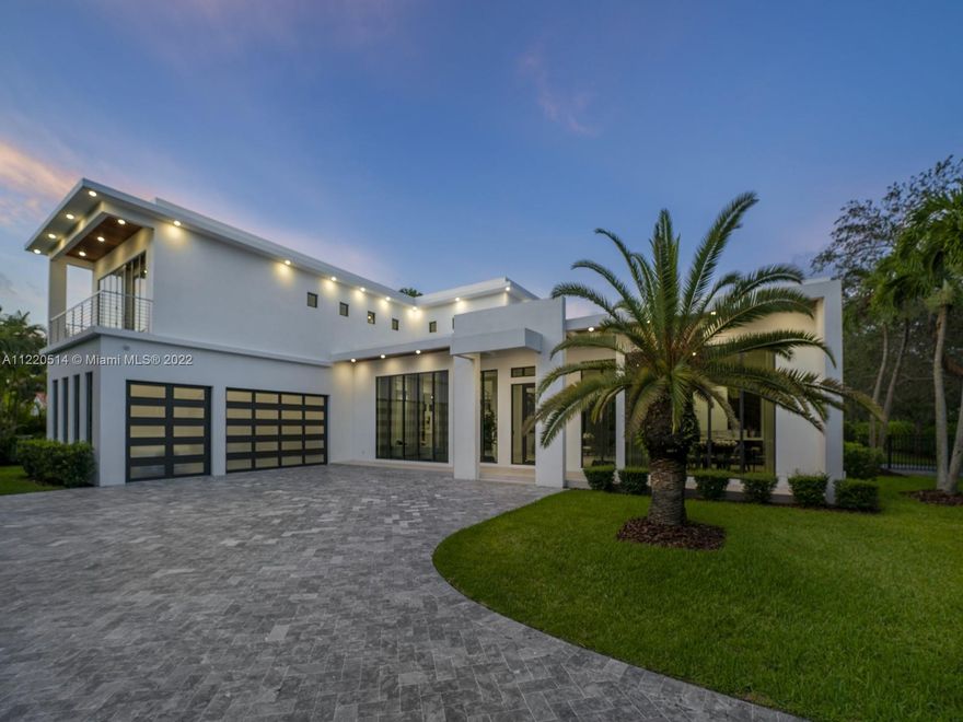 Spectacular 2021 two-story modern smart home located in sought after N Pinecrest. This recent build has it all from the minute you enter through the door. Discover a sweeping open flrplan w/ volume ceilings, gorgeous formal living rms, custom built wet-bar & formal dining rm. Enjoy a beautiful gourmet kitchen w/ custom cabinetry, top-of-the-line appl, & oversized gas range, all while overlooking a spacious family room. Take a ride in a home elevator to the second flr where you will find 4 en-suite bedrs including a lavish master suite w/ decorative fireplace & spa bath. An outdr retreat awaits w/ large covered terrace, fully equipped summer kitchen, swimming pool/spa, & ample yd. Add’l Features: Imp win/drs, laundry rm, 3 car gar, concrete roof, & generator ready.