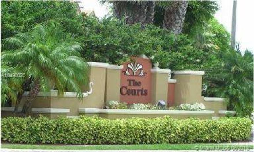 The Courts at Doral, Excellent purchase opportunity to own a spacious 3 bedroom& 2 bathroom with private entrance, formal dining, living and family room with easy access to balcony. Large master bedroom with master bathroom. Wood laminate floors and tile throughout. Large kitchen with eat-in counter and washer and dryer hook-up inside the unit. Community offers a clubhouse, large community pool and excellent sitting area to entertain with lake view. Gated community with easy access to specialty stores and restaurants.