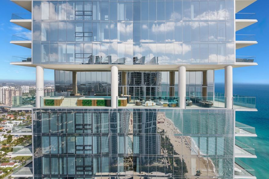 One-of-a-Kind. The Ultimate Sky Villa. 11,300 sqft Unmatched in finish, a True Masterpiece—this 7,000 SF reimagined trophy residence at Turnberry Ocean Club stuns with 11’ ceilings and soaring 22’ heights in the grand foyer and living room. Outside a 4,000 SF covered LOGGIA with coral stone, teak finishes, private pool, Jacuzzi, BBQ, and upgraded 6’ glass railings to ensure family security. 1,000 SF Oceanview Master dressing with Walk-in Jewelry Safe, full Ivory Onyx his & her bath with Dornbracht fixtures + Toto Zero-Gravity Tub. Upgraded Snaidero cabinetry, Gaggenau appliances, Scavolini-designed bedrooms with expanded closets. Ocean-to-Intracoastal flow-through design, Private Beach cabana, 6 Parking incl. A/C 2-Car Garage. Fully integrated Control4 smart home. A True Work of Art!