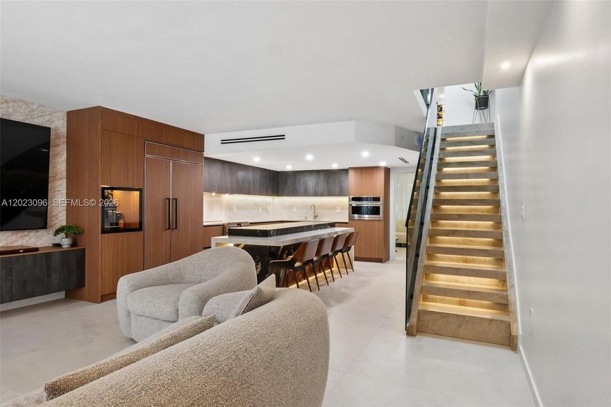 Rarely available fully renovated modern residence offering the feel of a private home in the heart of Key Biscayne. Features a custom kitchen with high-end appliances including Sub-Zero, Monogram, Fulgor Milano, and Bosch, plus Taj Mahal quartzite countertops and Cristallo finishes. Open layout connects to a private patio with jacuzzi. Includes glass staircase, custom cabinetry, and designer lighting. Enjoy pool, landscaped grounds, playground, and private beach access. HOA $1,039/month. Turnkey.