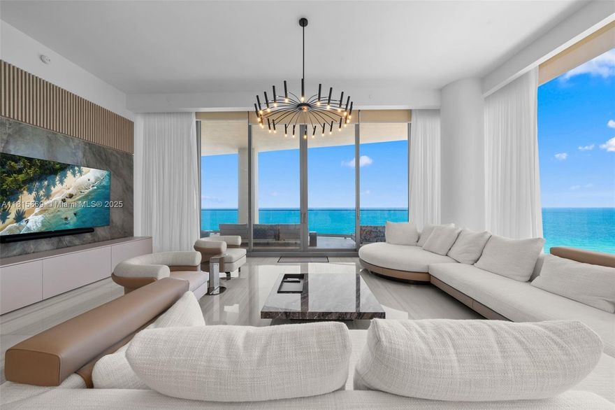 Discover this immaculate Milano Residence at the Estates at Acqualina, a 4-bed + staff room, 6.5-bath with over 5,500SF of interior space. This fully automated smart home features soaring 12-ft ceilings, custom built-ins, floor-to-ceiling glass showcasing panoramic ocean & Intracoastal views. The primary suite is a private retreat with a sitting area, custom closets, onyx-clad spa-style primary bath with soaking tub, steam shower, and double vanities—all with water views. The chef’s kitchen boasts a La Cornue gas range & the outdoor terraces feature a summer kitchen, built-in grill, and private sauna + jacuzzi. 5-star amenities: Rolls-Royce house car, cinema, spa, fitness center, F1 & golf simulators, ice-skating rink, cigar lounge, bowling alley, and 3 pools with FlowRider wave & slide.