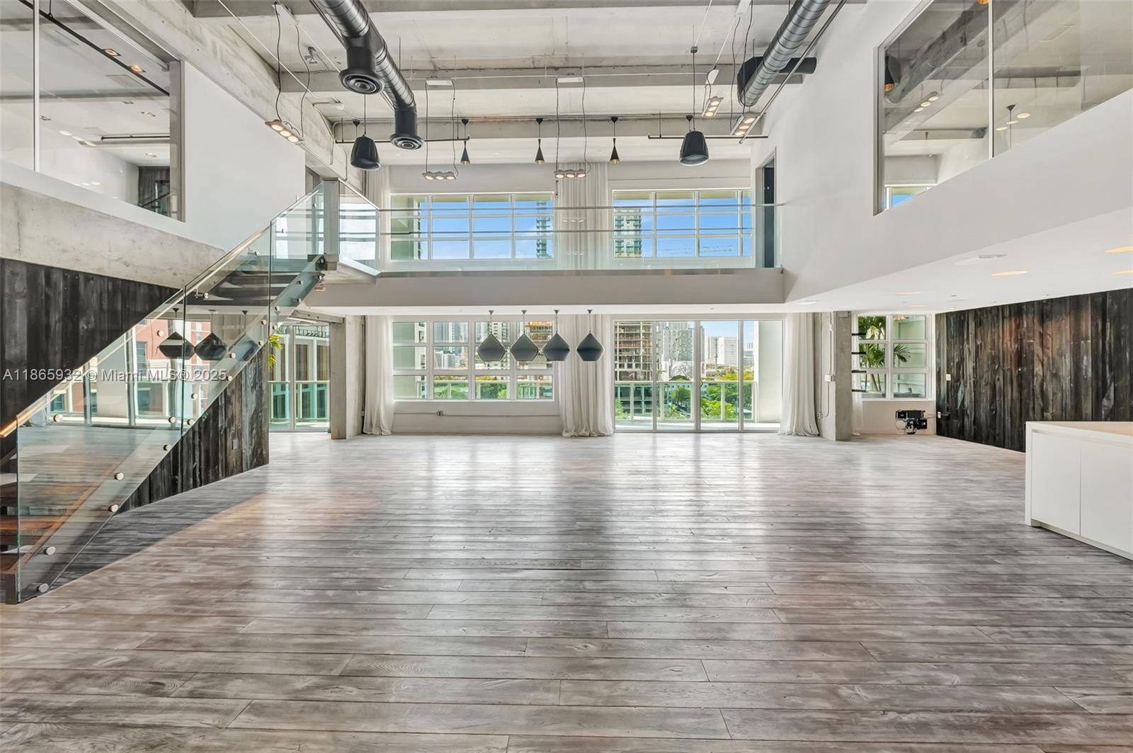 IMPECCABLE... 2 story 3,300 Sq ft penthouse close to downtown Miami & Wynwood. No expense spared in this “ultra cool loft” from the fixtures to the finishes, soaring 20’ ceiling heights & wood floors throughout. A premier Loft space w/ a bridge connecting 2 bedrooms on 2nd floor w/ 550 sqft covered terrace. #608 has been exquisitely upgraded w/ Italian kitchen cabinets, NEF coffee machine, oven, DW, Viking refrigerator, Crestron prodigy lighting system, black glass Italian doors, light fixtures by Tom Dixon. All bedrooms equipped w/ TV & stereo for the common area. Laundry rm w/ Bosch lg capacity W/D. The 3rd bedroom was designed to work equally as a family room/media rm w/ a lg barn door separating it from the Living room. Loft comes w/ 2 parking spaces. Call Agent for private showing.