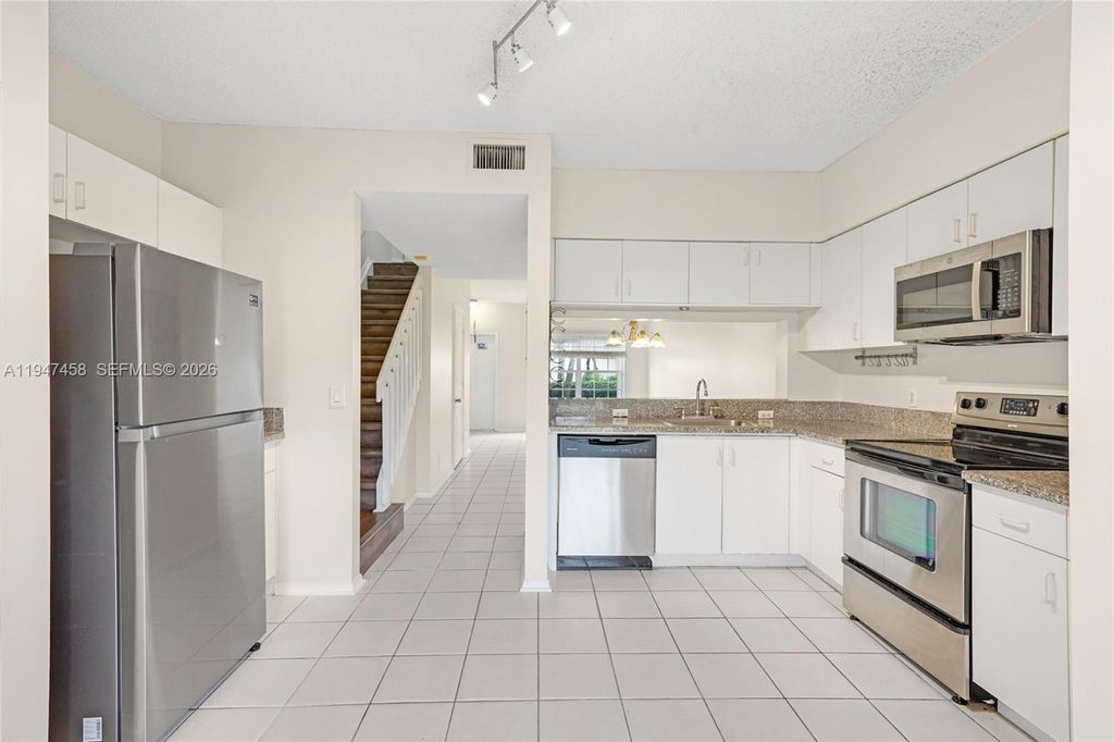 Photo of 4 Key West Ct #4, Weston, FL 33326 (MLS # A11947458)