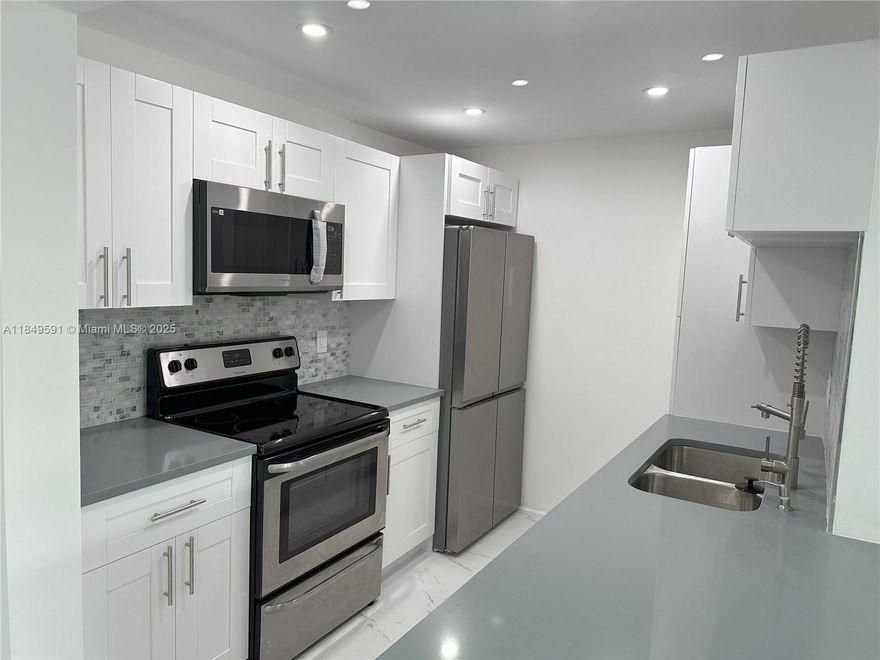 BEAUTIFUL COMPLETELY REMODELED WATERFRONT CONDO, 2 BEDROOMS, AND 2 BATHROOMS. CUSTOM KITCHEN WITH WOOD CABINETS, QUARTZ COUNTERTOP, AND STAINLESS STEEL APPLIANCES. PORCELAIN FLOOR INSTALLED. NEW GORGEOUS BATHROOMS WITH PORCELAIN AND CROME FIXTURES. CORNER UNIT WITH A WONDERFUL VIEW OF THE CANAL AND GARDEN. LOT OF STORAGE ROOM. CLOSE TO FAU, WORSHIP PLACE, RESTAURANT, AND MAJOR HWY.