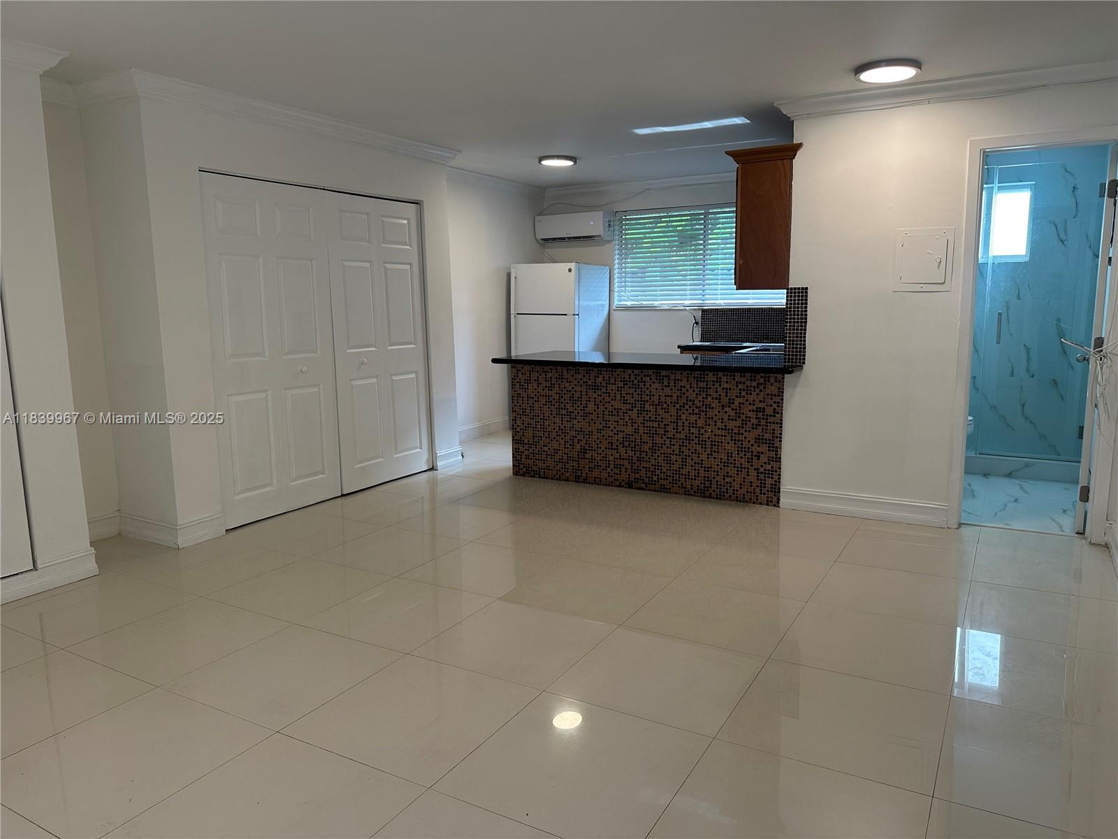 This bright and modern studio offers the perfect blend of style and location. Recently updated with tasteful finishes and an open layout, the unit is filled with natural light and charm. Located in one of Miami’s most desirable neighborhoods, you're just steps from lush parks, trendy cafés, local shops, and vibrant nightlife. Washer/dryer hookup available in-unit for added convenience. Live where the Grove’s charm meets everyday ease!