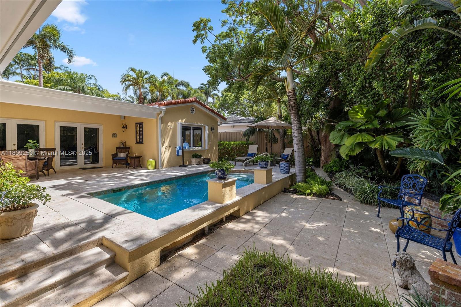 On the quiet side of historic Tigertail Ave. Welcome to your private oasis in Miami’s most coveted neighborhood, North Coconut Grove! Beautifully updated, blending luxury, comfort & convenience. Brand-new 2025 roof, heated salt treated pool with swim jets, chef’s kitchen with Thermador appliances. Luxurious primary includes spa-like bath with custom tilework and French doors to private patio with outdoor shower. Complete impact glass, Set on gated lot with electronic entry, lush landscaping, & garage. Located 21.9 feet above sea level in a no-flood zone. Walk to the Bay just 1.2 miles to Metrorail and Vizcaya 1.8 from Cocowalk. Short drive or bike to beaches. MIA a 20 minute drive! Absolutely pristine property. Private roaming police patrol. Pre-inspected by Allied, report available.