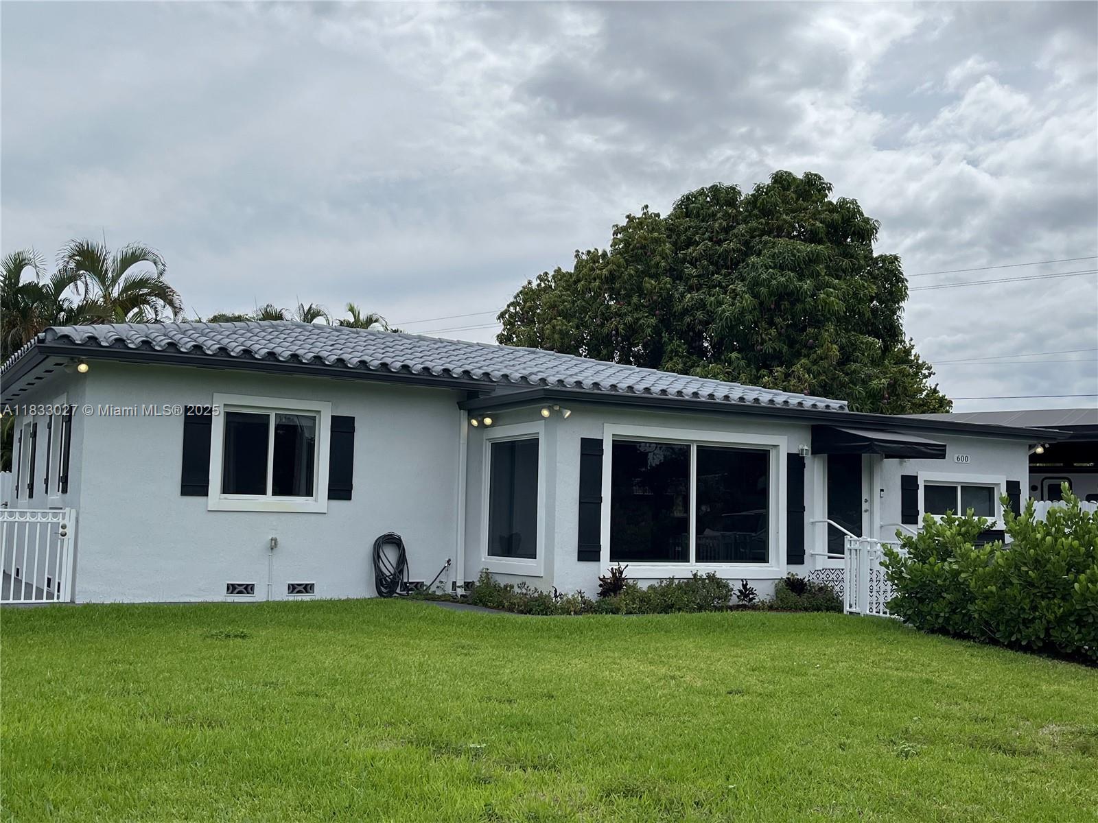 Remodeled Corner House, Centralized in the middle of Miami in the beautiful & desired area of Miami Springs! Close to MIA airport, major highways, stores, restaurants & shopping. This 3 Bedrooms +2 Baths house offers a large living room w/a huge window looking into the yard, white wood cabinets w/granite countertops throughout the kitchen, laundry & bathrooms w/stainless-steel appliances & gray vinyl wood planks floors throughout the house. Master bedroom has large walking closet & door to the yard. The laundry room has tile floors, cabinets & a door to the yard, as well. The roof was recently replaced & impact windows/doors. The yard is all fenced in, w/a great shed, canopy, & w/an amazing mango tree. Great parking spaces! Available Sept 1.