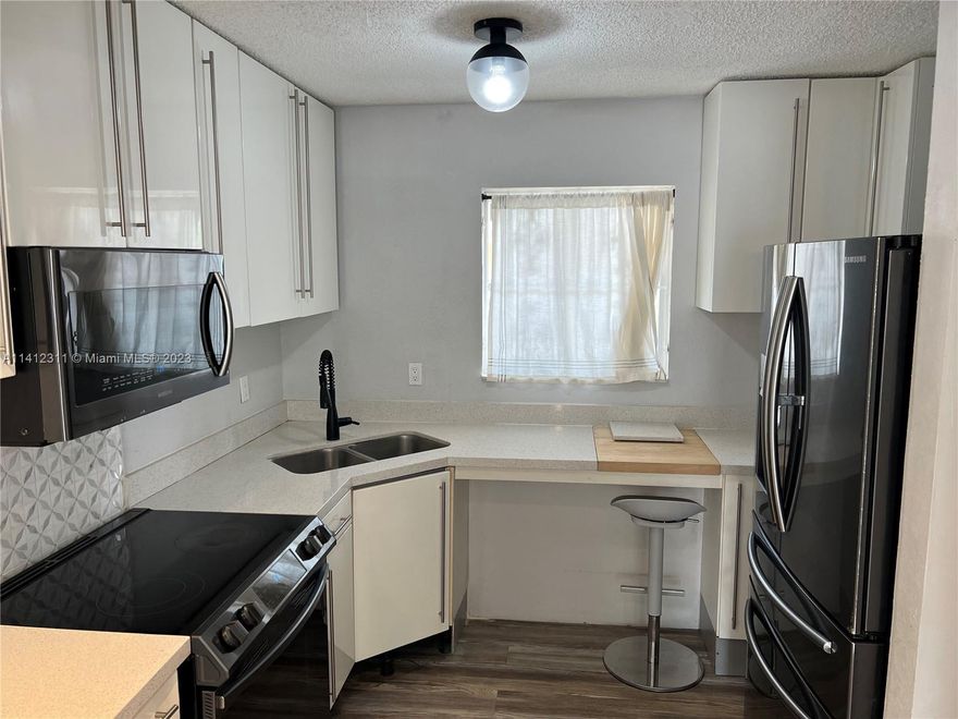 Welcome to your dream rental condo in the heart of Hialeah! This stunning residence boasts 2 bedrooms and 2 bathrooms, providing the perfect space for you and your loved ones. As you step inside, you'll be greeted by the sleek and modern design, featuring stainless steel appliances that add a touch of elegance to the kitchen. The tile flooring throughout the condo not only enhances the overall aesthetic but also ensures easy maintenance and durability. One of the standout features of this condo is the convenience of having 2 assigned parking spaces, allowing you to comfortably accommodate your vehicles without any hassle. Located on the first floor, this corner unit offers privacy and tranquility, making it an ideal retreat after a long day.