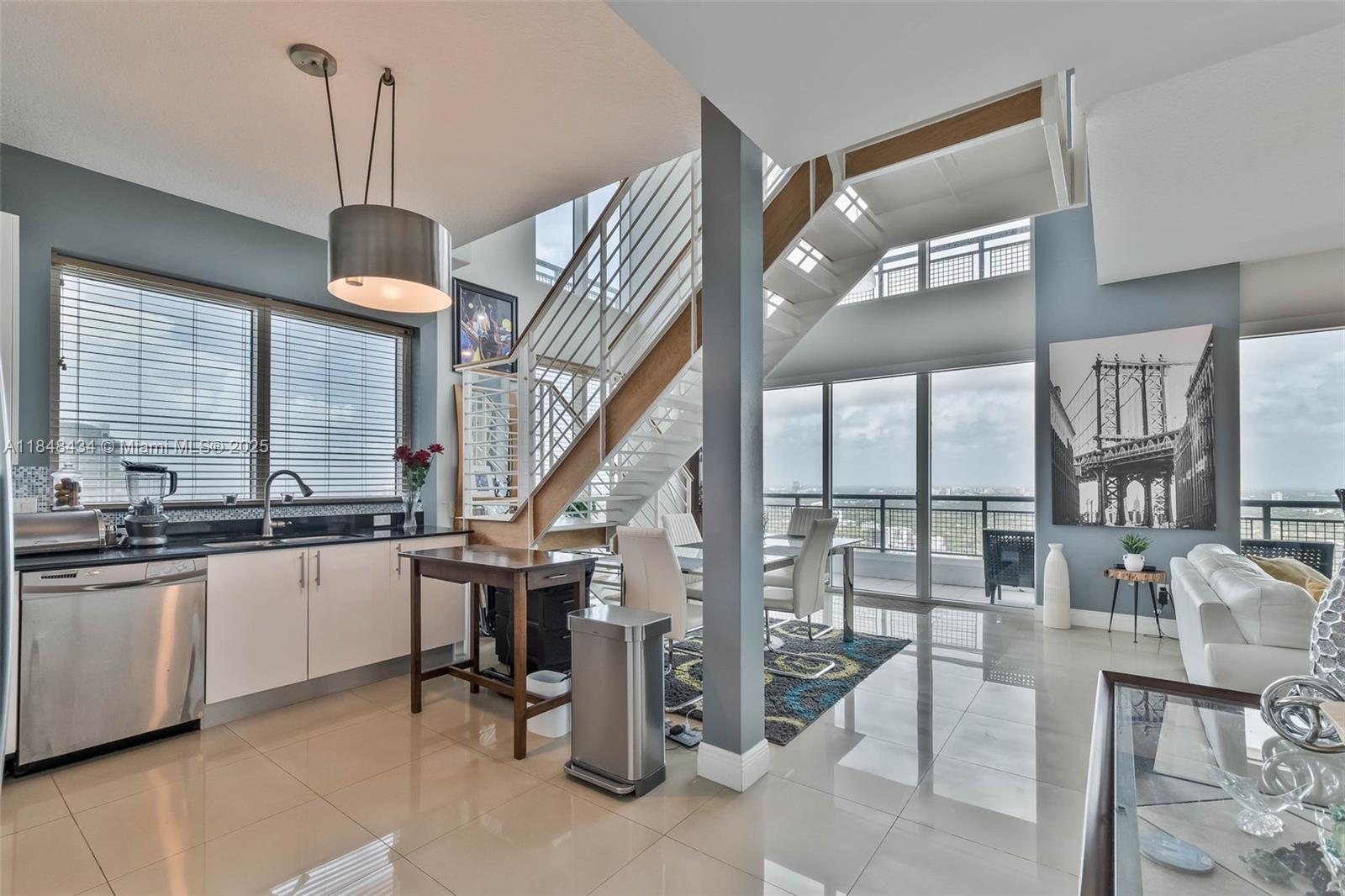 Step into sophisticated urban living with this upgraded 2-bedroom, 3-bathroom loft-style residence in the coveted 01 line at Infinity. With over $80,000 in custom upgrades, this home features fully enclosed bedrooms—each with its own en-suite bathroom—offering both privacy and functionality.
Soaring double-height ceilings and expansive floor-to-ceiling windows flood the space with natural light, creating a dramatic yet inviting atmosphere. The modern kitchen boasts sleek cabinetry, granite countertops, and stainless steel appliances—ideal for both daily living and entertaining.
Take in breathtaking panoramic views from your private balcony and enjoy access to world-class amenities including a resort-style pool, fully equipped gym, and 24/7 security.