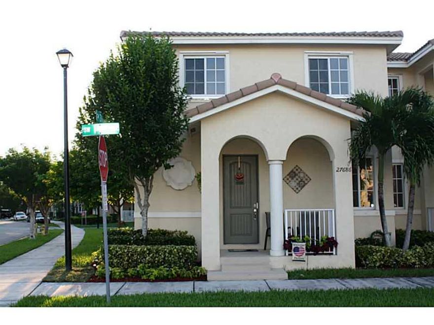 Better than New! 3 /2.5 plus a loft that can be converted to a 4th bedroom, super clean and well maintained. Tile downstairs carpet upstairs. Kitchen with SS appliances all included in the sale. Corner unit has a yard on the side for the children to enjoy . Association includes cable, Internet, alarm, lawn service, security patrol and resort style pool with fitness center. One car garage located in the rear of the residence for more privacy. Washer & Dryer inside the residence. Ready to move in!!