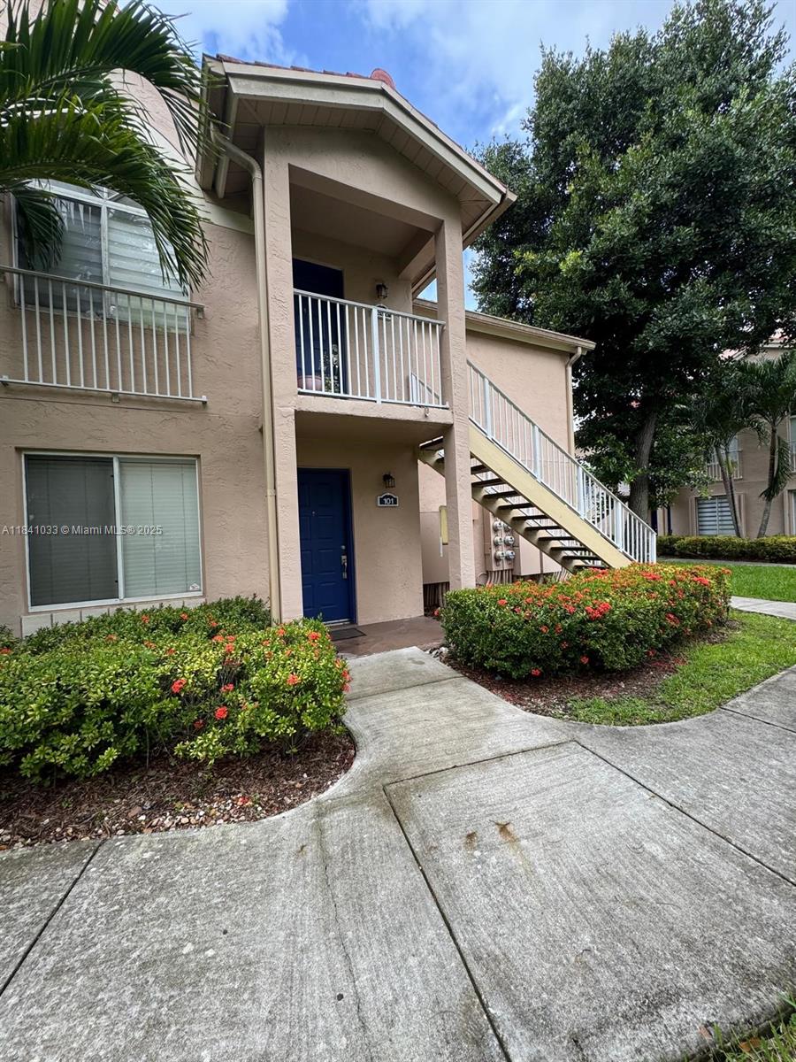 Modern Ground-Floor Unit in The Hammocks. This beautifully updated first-floor apartment offers a bright and functional layout with direct access to a private open patio. Enjoy a remodeled bathroom, open concept kitchen, plus the convenience of an in-unit washer and dryer. Water is included in the rent. Located in The Hammocks, a sought-after resort-style community with amenities including pools, fitness center, tennis courts, basketball courts, walking trails, and more. One assigned parking space and ample guest parking.