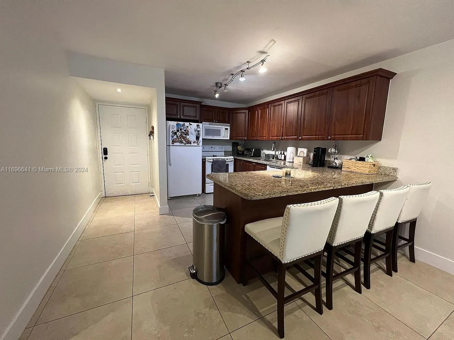 First floor corner unit near City Center Doral. Plenty of parking and easy access to the unit. Bright and clean, ready to move in. Large living area with sliding glass door to the in closed lanai. Large kitchen with granite countertop. Large bedrooms with impact glass windows. The unit offer a nest thermostat and electric door lock.