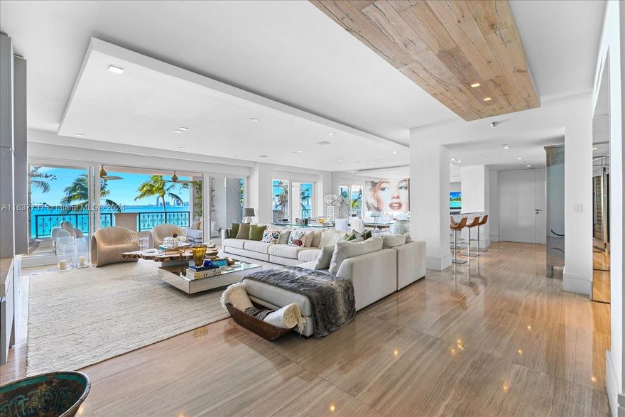 Experience the epitome of Fisher Island living in this stunning completely renovated Bayview unit professionally designed and decorated with no expense spared, ensuring an unparalleled experience! Indulge in the luxurious comfort of 4 bedrooms, 4.5 baths and a spacious 3,790 sq ft interior open floor plan. Be enchanted by sweeping views of the Miami downtown skyline with expansive terraces ideal for entertaining. Features include: two spacious principal bedrooms with terraces overlooking Biscayne Bay and downtown Miami, wine cellars, elegant marble floors throughout, gourmet kitchen, top of the line appliances, impact glass doors, automated window treatments and countless of other features. Live the Fisher Island lifestyle in this exceptional unit that is offered fully furnished.