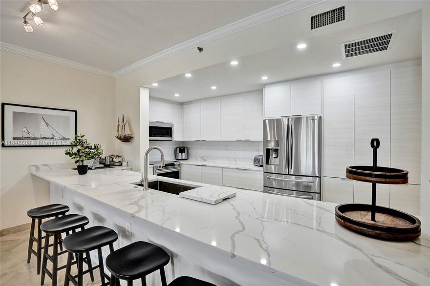 Experience the best of both worlds at spectacular Williams Island. This fully remodeled 3BD/2BA residence feels like a private home with all the elegance of luxury condo living. Enjoy breathtaking pool and marina views, marble floors, a custom kitchen with high-end appliances, and spa-inspired bathrooms. The resort-style community offers 15 tennis courts, 4 pickleball courts, a full-service spa, marina, 4 restaurants, Starbucks, a dog park, walking trails, synagogue, and a courtesy bus. The unit includes generous storage and one parking space with valet or self-park options. Special assessment will be paid in full by the seller. Discover unmatched comfort and convenience.