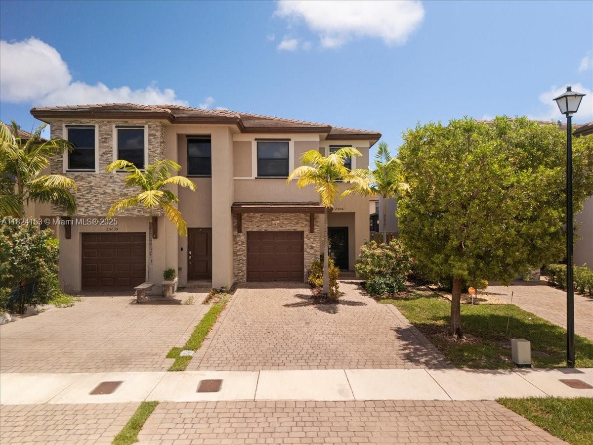 This beautifully upgraded 3-bed, 2.5-bath twin home in Campo Bello is move-in ready and perfect for entertaining. The standout feature is the private backyard oasis with lush landscaping, tall palms for privacy, a tiki hut with bar, and a covered terrace with ceiling fans for outdoor dining space. Inside, enjoy quartz countertops, stainless steel appliances, a remodeled powder room, tile flooring on the first level, laminate upstairs, a full laundry room, and included security cameras. Located in a resort-style community with a pool, fitness center, clubhouse, and playgrounds, this home offers comfort, style, and convenience.