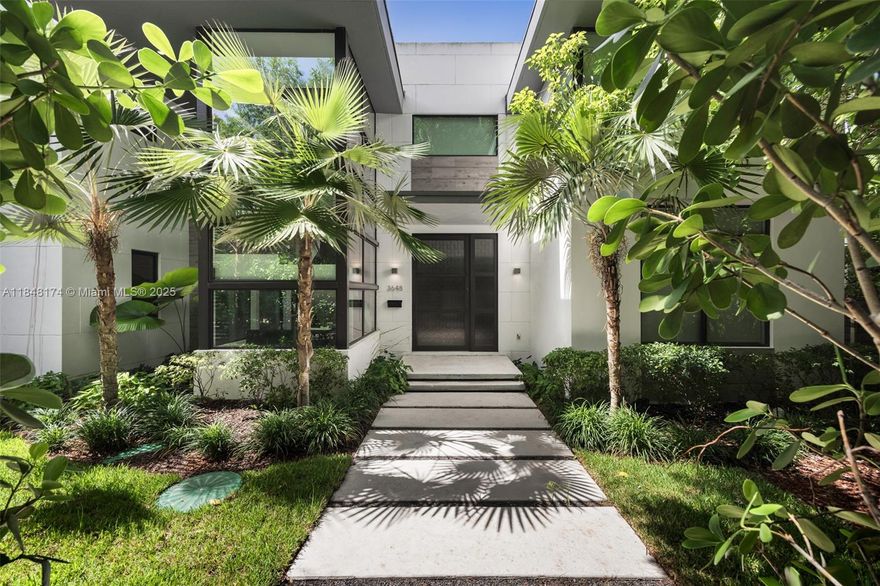 Spectacular, modern-style residence with a tropical vibe. Located on a quiet, tree-canopied street in South Coconut Grove. Captivating living spaces - created with walls of glass, high ceilings and abundant natural light- fully embrace the indoor/outdoor lifestyle. Stunning, European-style kitchen features cooking island, walk-in pantry & top-of-the line appliances. An ideal floorplan layout offers a ground-level guest suite, a 2nd level den/family room + 3 additional bedrooms including the primary suite that features a room-size walk-in closet, a spa-like bathroom & a balcony overlooking the tranquil pool & lush garden. Walk or bike to the historic Grove village’s galleries, boutiques, cafes and bayfront parks & marinas. Just minutes to downtown, MIA & the Beaches.