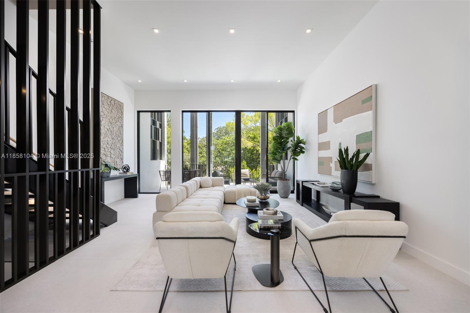 Award-winning contemporary residence in The Roads Townhomes featuring a distinctive formed-concrete façade. A dramatic open stairwell, volume ceilings and skylight define the airy interior. The sprawling second-floor living space with 12’ ceiling flows to a giant, glass-walled terrace. The chef’s kitchen offers Italian cabinetry, Wolf-Sub Zero appliances, porcelain slab surfaces and 10’-wide island for prep and counter dining. Spa-style master bath includes a freestanding tub, dual vanities and glass-walled shower. Additional highlights: multiple balconies, sound-insulated, private entry courtyard, Mondrian-inspired privacy screens, full-size 2-car garage and concrete construction with impact glass.