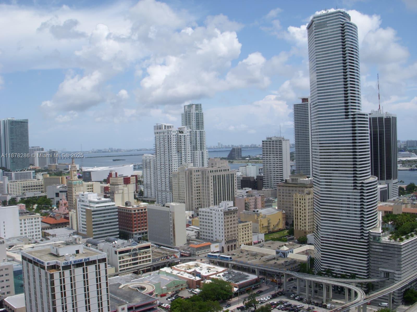 Don't miss this beautiful 1 bedroom/1 bath + den. Modern kitchen with lots of cabinet space. Bathroom also have lots of storage. Washer and Dryer in unit. Stunning porcelain floors throughout with a huge balcony with stunning views of the city skyline, you will be in the clouds :) Right off I-95, and walking distance to BCC (Brickell City Center). You can also walk o the Kaseya or the Arsh Center or take the Metro-mover or train. The building offers pool and jacuzzi, fitness center and racquetball court, spa, movie theater, kids playroom, and much more.