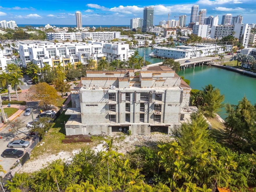 Rare waterfront development opportunity in Miami Beach. Prime 10,200 SF lot (0.23 acres) located at 10 South Shore Dr, featuring an under-construction five-story multifamily project. Plans include 6 luxury residential units and 12 parking spaces, with a projected total building area of approximately 17,435 SF.

Proposed residences range from 1,165 to 1,742 SF, designed for modern upscale living, many with direct Intracoastal canal views. The property offers waterfront access with capacity for up to 4 boats (up to 40 ft each), providing a unique opportunity for luxury waterfront development.

Zoned RM-1 (Multifamily Residential), this offering presents exceptional potential for developers and investors seeking a high-end residential project in a desirable Miami Beach location.

Property is currently classified as vacant land per public records. Existing structure is under construction. All information, including square footage, unit layout, and development details, is based on architectural plans and subject to verification. Buyer responsible to independently verify zoning, permits, and development potential. Sold as-is.