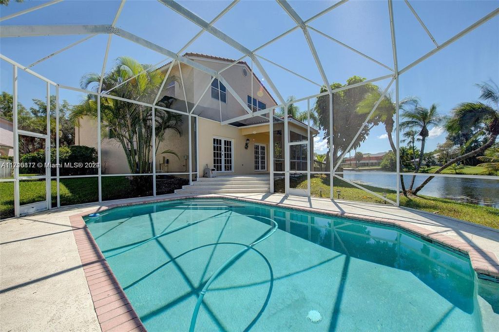 Photo of 9867 Fairway Cove Ln, Plantation, FL 33324 (MLS # A11710877)