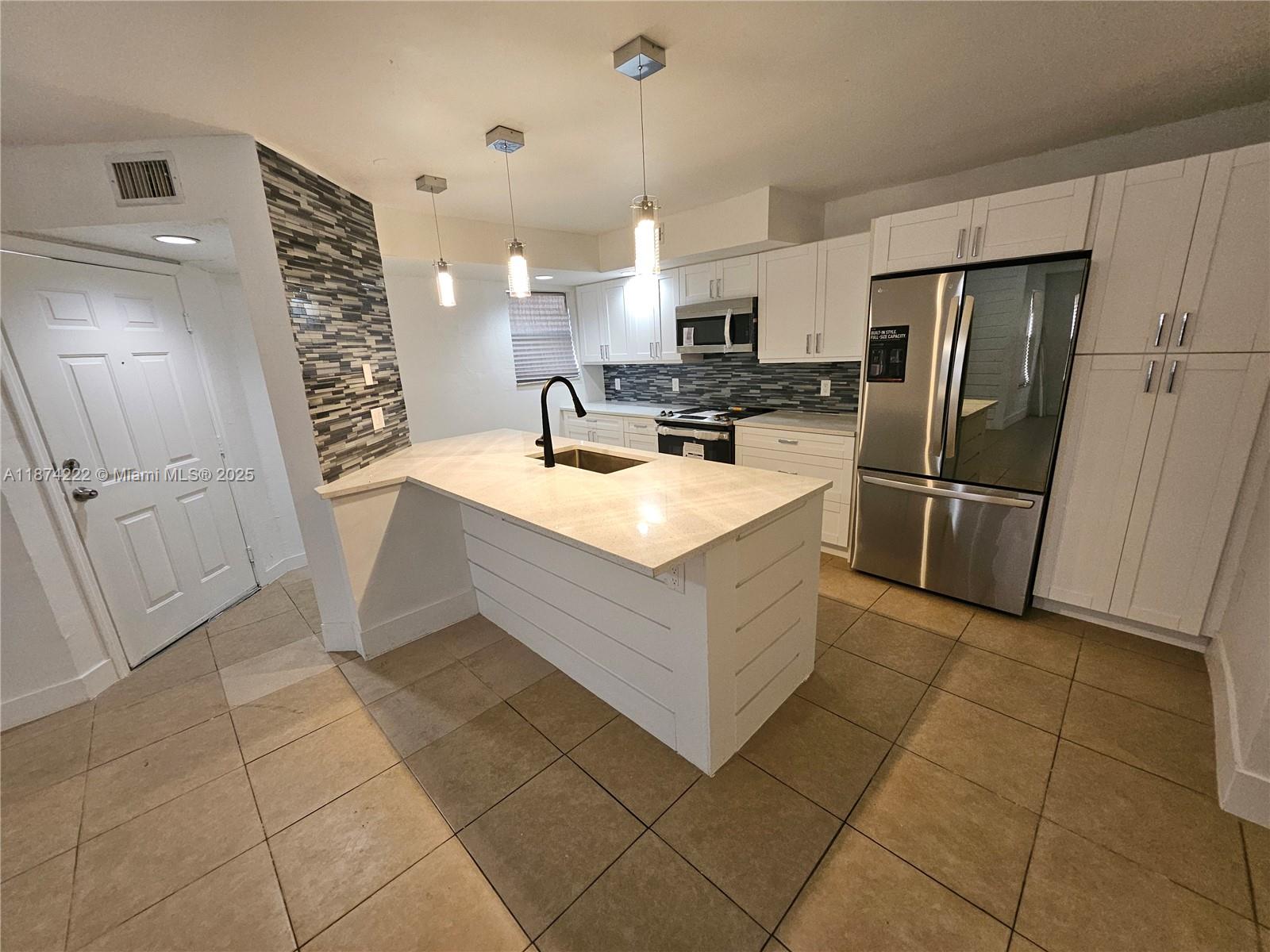 Renovated 2/2 with washer and dryer. wood cabinets in the kitchen with quartz counter tops. stainless steel appliances. Both bathrooms were renovated. The community has 2 pools and a gym. Must be approved by association.