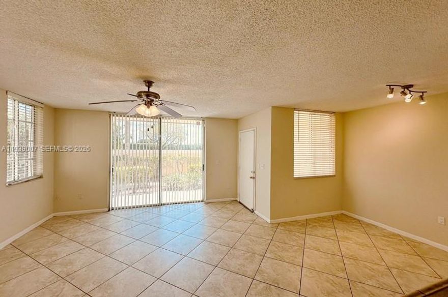 This beautifully maintained 1st-floor unit offers a modern, open layout with tile flooring in the living area and stainless steel appliances in the kitchen. Convenient in-unit washer and dryer included. Located in a sought-after, gated community, the condo offers fantastic amenities, including a large pool, whirlpool, gym, indoor racquetball court, sand volleyball, play area, and picnic areas with grills. Whether you're looking for a comfortable place to live or a great rental investment, this unit is perfect for both. Enjoy the best of community living and excellent location. Don’t miss out on this opportunity!----------UNIT RENTED TILL 6/30/2026, PAYS $2,000.00 PER MONTH - TENANT CAN SHOW THE UNIT WITH 24HS NOTICE