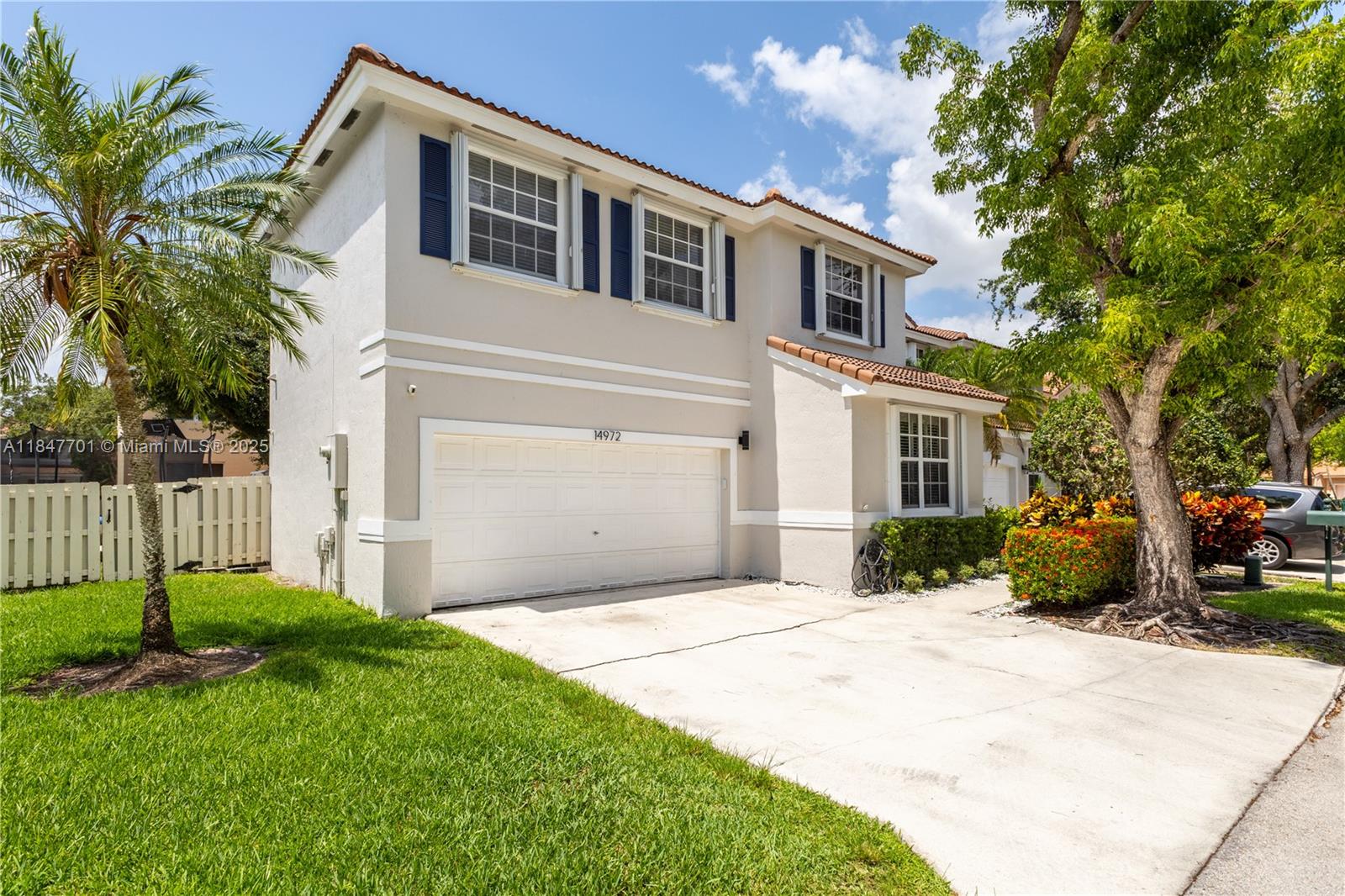 Welcome to the private Regency community in Davie, FL! Across from Southwest Ranches and zoned for A-rated schools like Hawkes Bluff Elementary, this 1997 corner lot offers 1,982 sq ft with 4 bedrooms and 2.5 bathrooms. Features include a 2-car garage, screened-in patio, and a modern kitchen with new countertops and stainless steel appliances. Enjoy tall ceilings, a spacious family room, and formal dining and living areas. The upstairs primary suite boasts a walk-in closet, dual sinks, soaking tub, and glass door shower. Three additional bedrooms share a renovated bathroom. The fenced backyard provides ample play space. Just 3 minutes to the community pool and 6 minutes to Vista View Park, this home is perfect for family fun and outdoor activities.