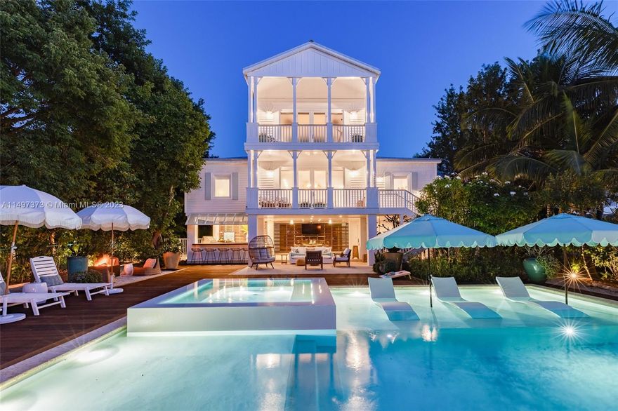 Welcome to The Resort on North Rolling Hill. As you step inside, the worries of the world fade away, and you are embraced by a haven of tranquility. Prepare to be captivated by breathtaking sunsets that grace your dream backyard 365 days a year. With approximately 72 feet of water frontage. Indulge in an oversized concrete pool and deep water dockage. This 4-bedroom masterpiece was professionally designed and decorated with meticulous attention to detail. Each bedroom in this sanctuary is an en-suite. Immerse yourself in your very own private basin. Entertaining is a breeze with a fully equipped outdoor kitchen. Nestled in the heart of Islamorada, you'll find yourself moments away from the finest restaurants and vibrant nightlife.