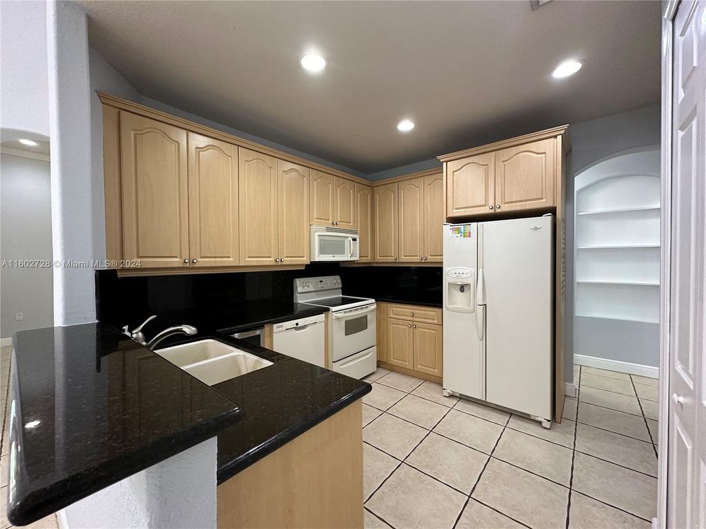 Photo of 2841 Poinciana Cir #2841, Cooper City, FL 33026 (MLS # A11602728)